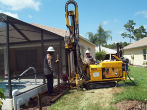 Contractors working on the foundation of a home